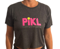 Person wearing a dark gray t-shirt with 'Pikl' logo and text on a white background